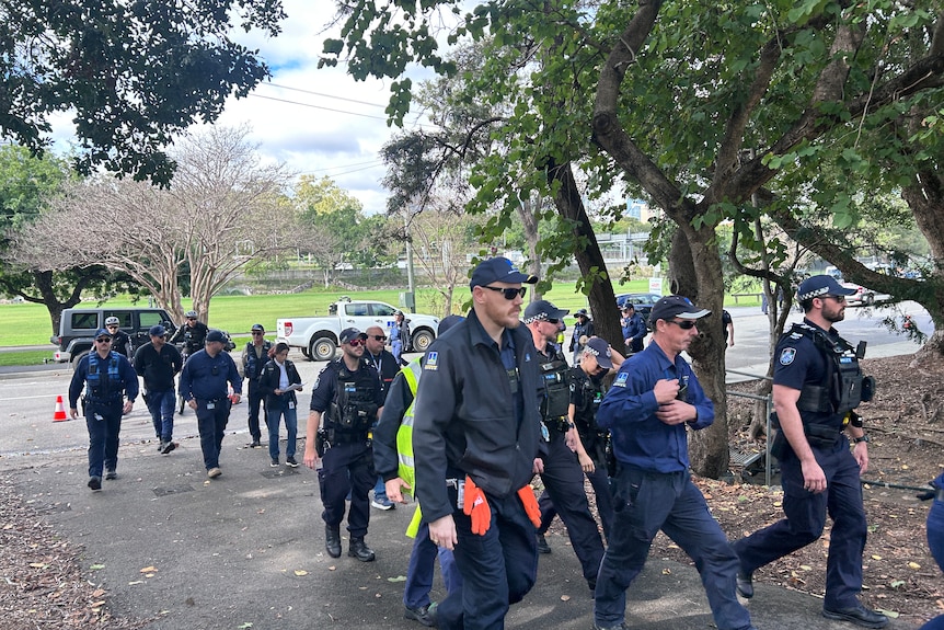 Police walking through a park