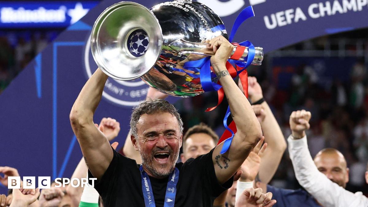 Paris St-Germain manager Luis Enrique smiling with the Champions League trophy