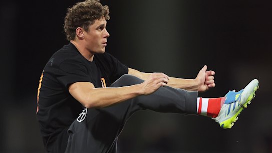 Charlie Curnow of the Swans warms up.