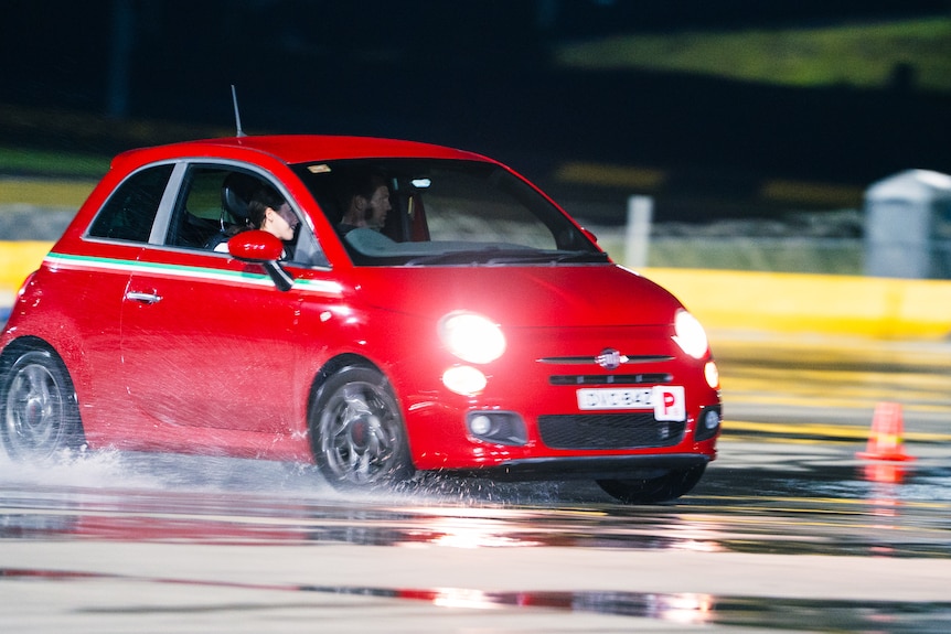 Cars drifting at a motorsport track in Sydney.
