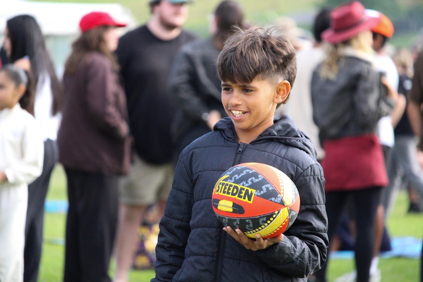 a young boy in the crowd