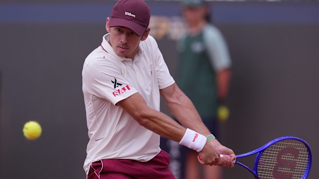 Australia's Alex De Minaur returns the ball to Italy's Matteo Arnaldi during their men's singles match at the Italian Open tennis tournament, in Rome, Friday, May 8, 2026. (Alfredo Falcone/LaPresse via AP)