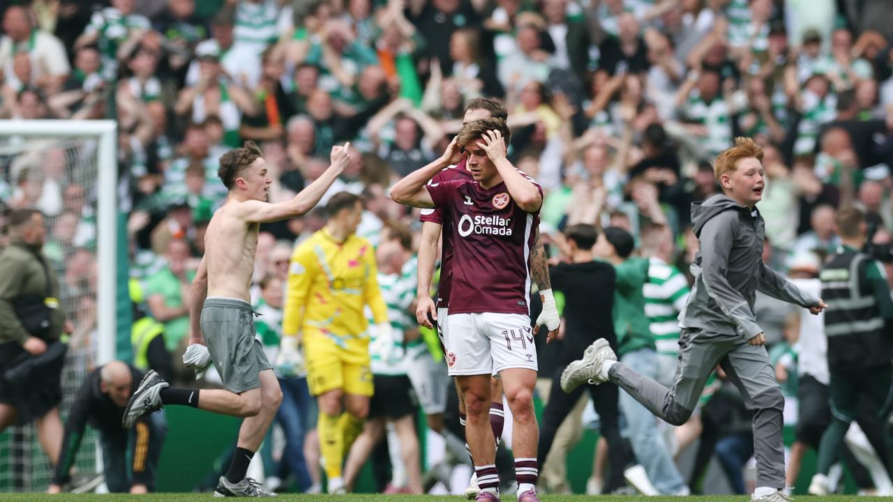 ‘SHAMEFUL’: Wild pitch invasion as Celtic snatch title, Hearts flee stadium after ‘abuse’