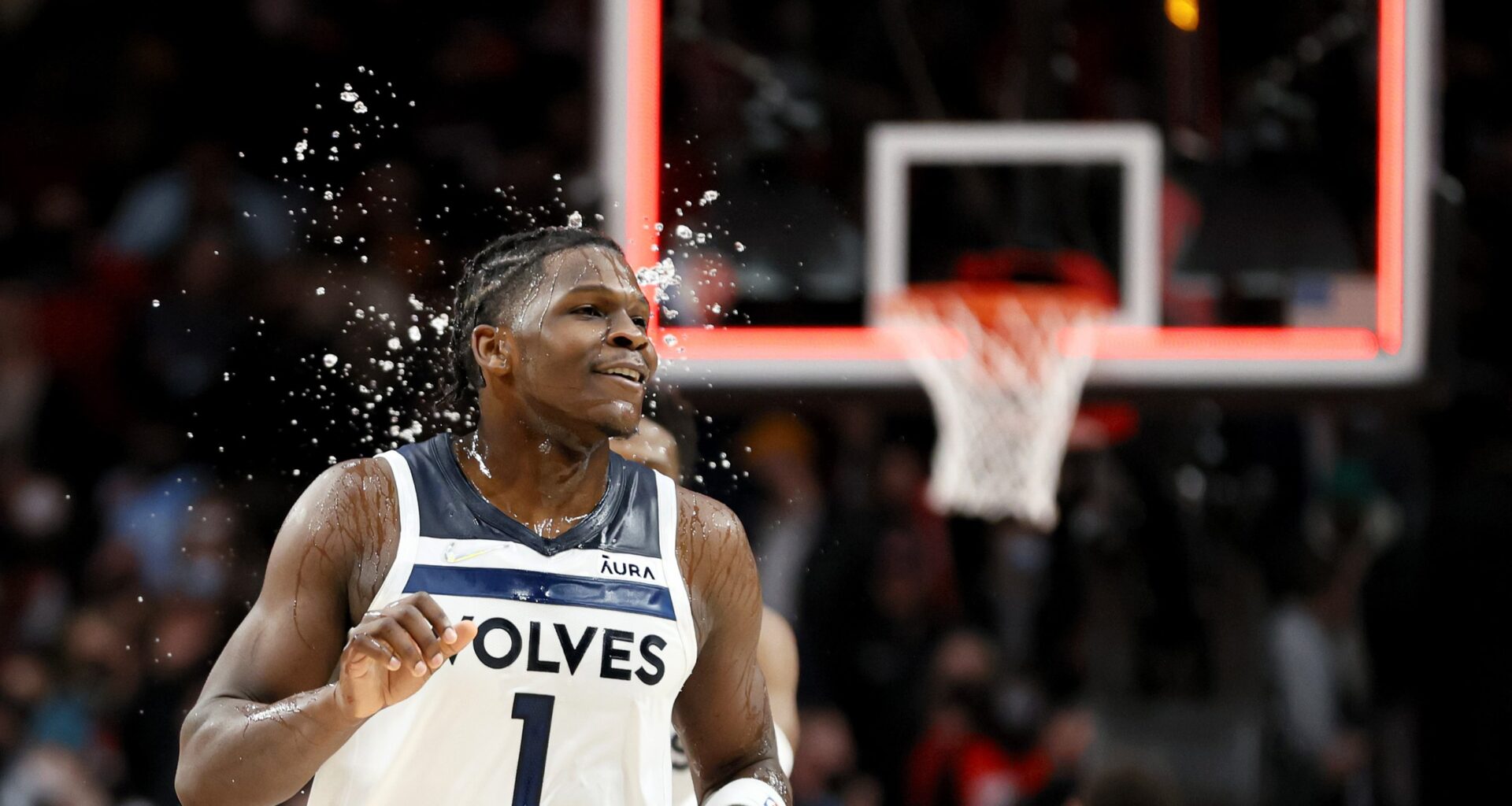 Anthony Edwards #1 of the Minnesota Timberwolves is doused with water after beating the Portland Trail Blazers 109-107 at Moda Center on January 25, 2022 in Portland, Oregon.