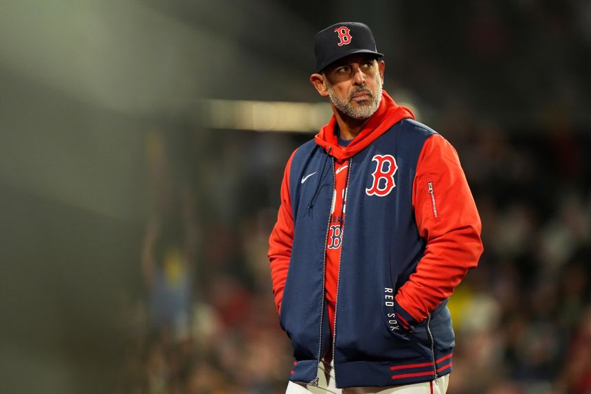 Then-Boston Red Sox manager Alex Cora walks off the field after a talk with the home plate umpire on April 7. Cora, who won the World Series with the Red Sox in 2018, was fired on April 25.