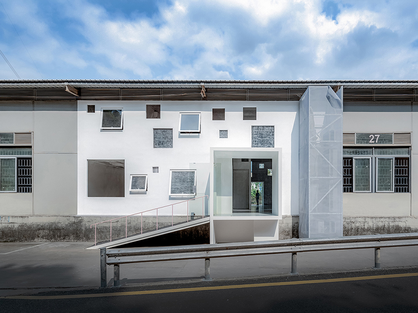 layered transparent walls transform former railway warehouse in shenzhen - 1