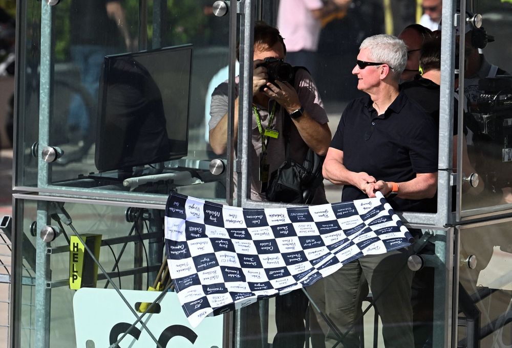 Little attention was given to Cook's appearance at the 2022 US GP as chequered flag waver