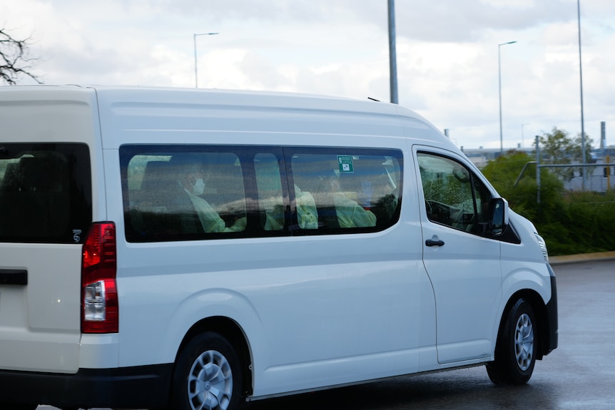 A minvan carrying passengers from the hantavirus hit cruise ship arrive at the Bullsbrook Centre for National Resilience.