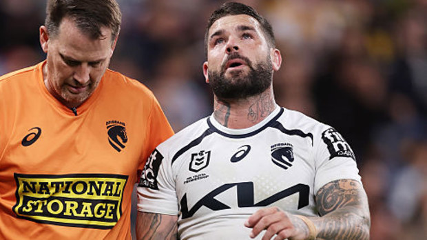  Adam Reynolds of the Broncos is assisted from the field after sustaining an injury.