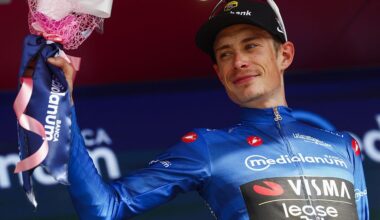Team Visma Lease a Bike Danish rider Jonas Vingegaard celebrates with the best climber's blue jersey on the podium of the 12th stage of the Giro d'Italia 2026