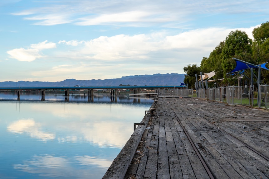A view of a wooden wharf area and temporary fencing in the vicinity of Port Augusta in SA.