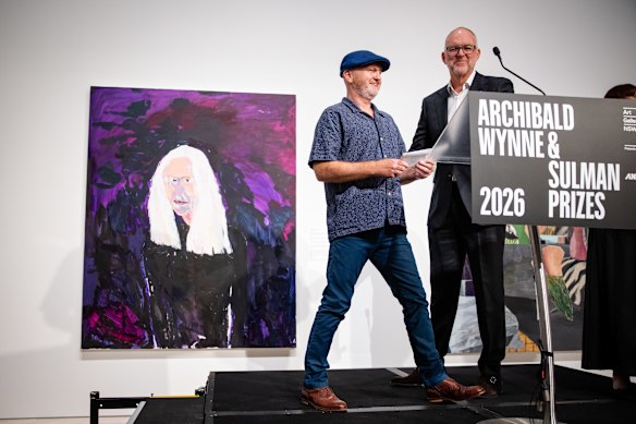 Art Gallery of NSW trust president Michael Rose (right) presents Richard Lewer with the 2026 Archibald Prize.