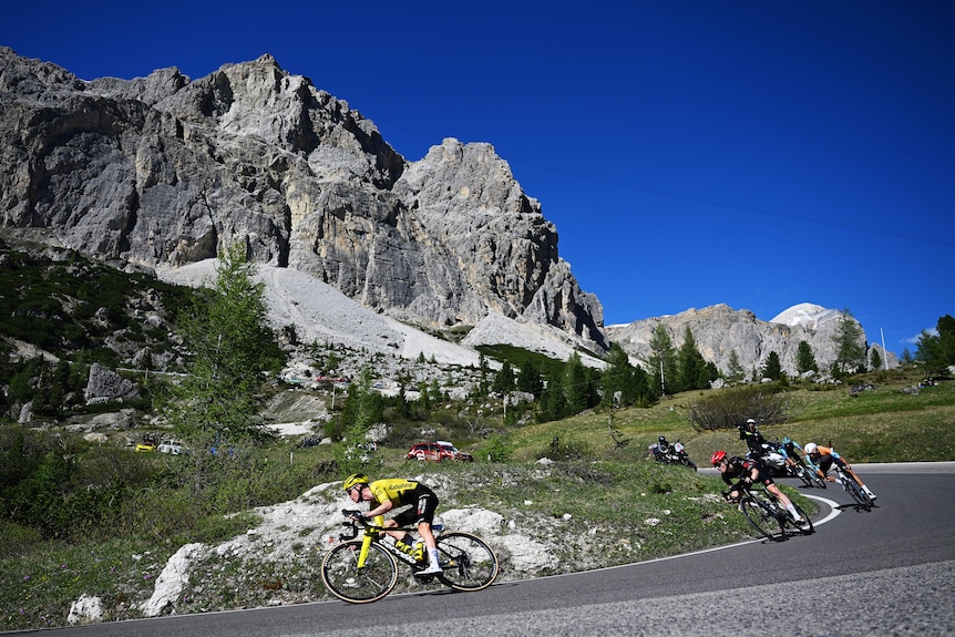 Sepp Kuss leads Michael Storer down a descent in Italy's mountains.