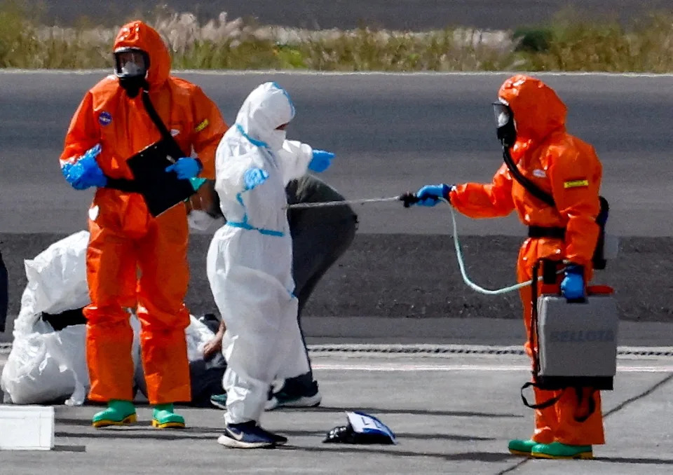 A passenger of the cruise ship MV Hondius, which was affected by a deadly hantavirus outbreak, is disinfected on the tarmac at Tenerife Sud airport in the Spanish Canary Islands earlier this month. The world’s top health leader says that the outbreak is ‘stable for now’ (Reuters)