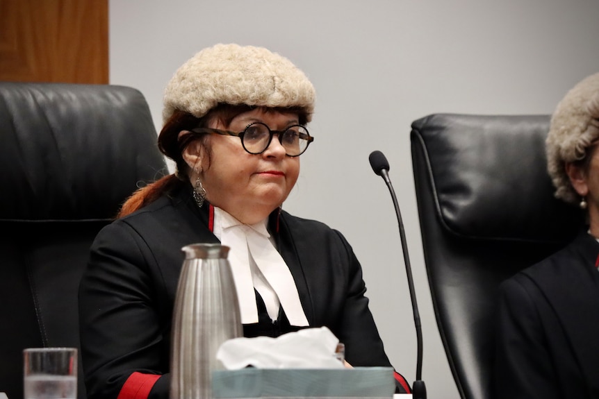 a female judge sitting in chair