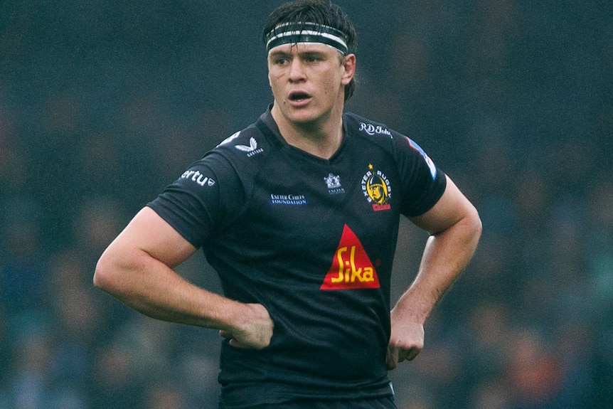 Tom Hooper with his hands on his hips playing for the Exeter Chiefs.