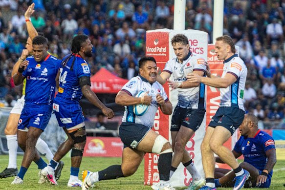 Ioane Moananu of the Waratahs scores one of his two tries.