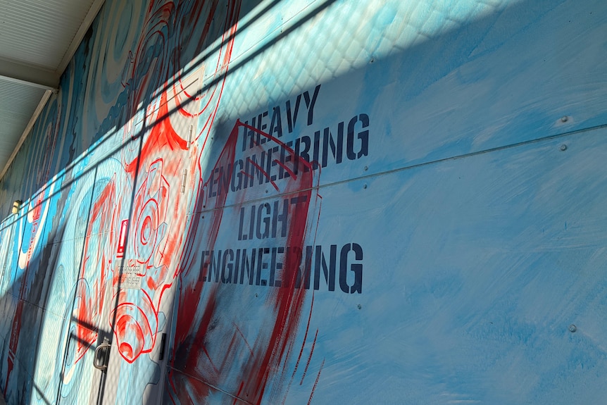 graffiti art on entrace to heavy and light enigeering room