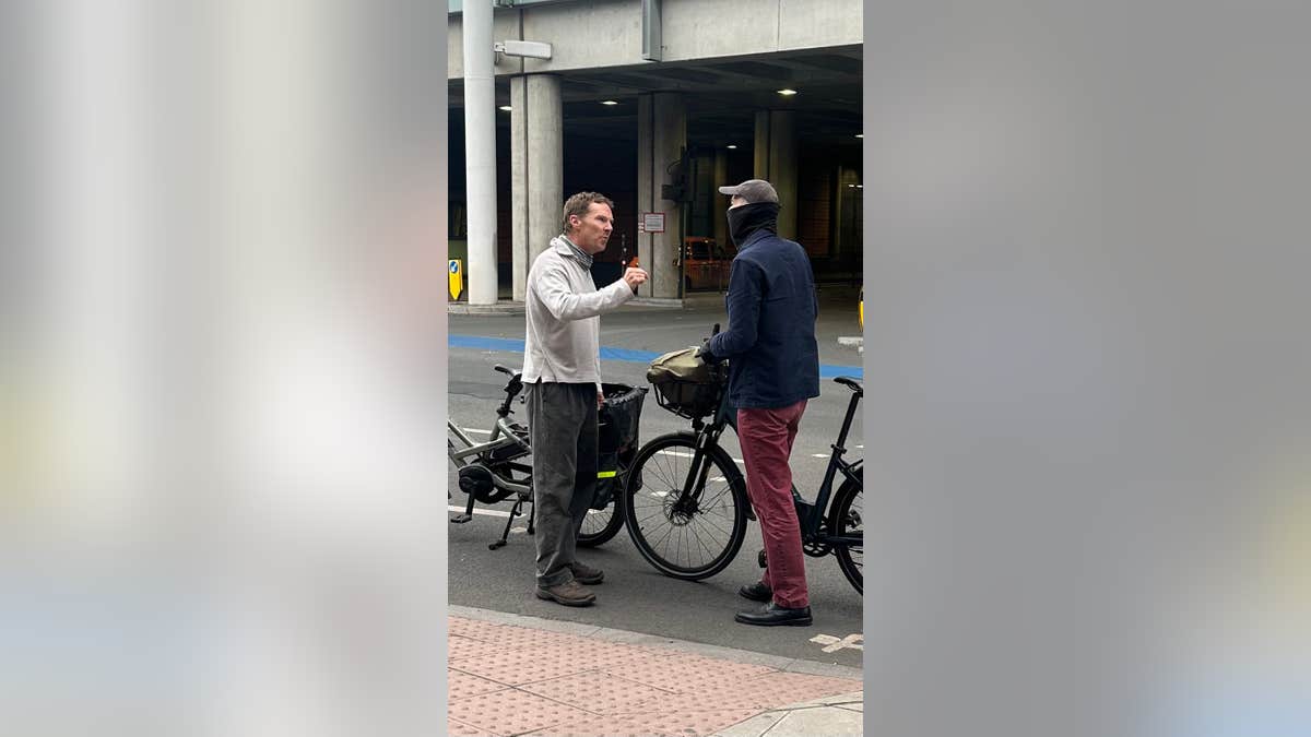 Benedict Cumberbatch arguing with a masked cyclist on St Pancras Road in London