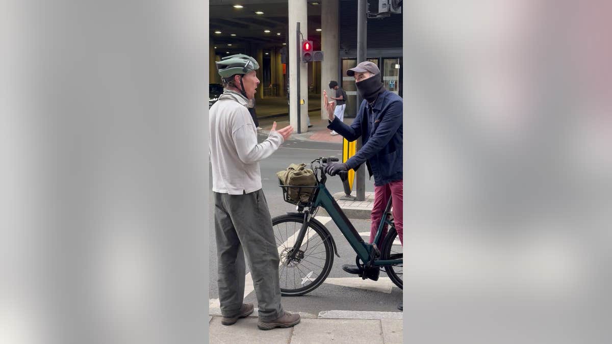 Benedict Cumberbatch arguing with a masked cyclist on St Pancras Road in London
