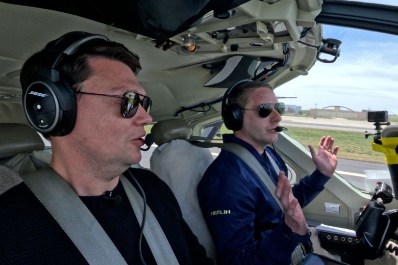 Test pilot Matt Diamond (right) takes his hands off the controls as AI accelerates the plane down the runway for takeoff as CNN's Pete Muntean looks on.