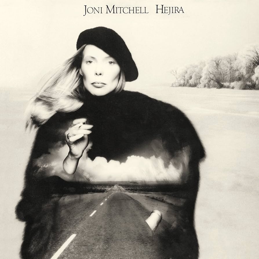 Album cover featuring a woman standing outside with an image of a highway projected on her dark clothing