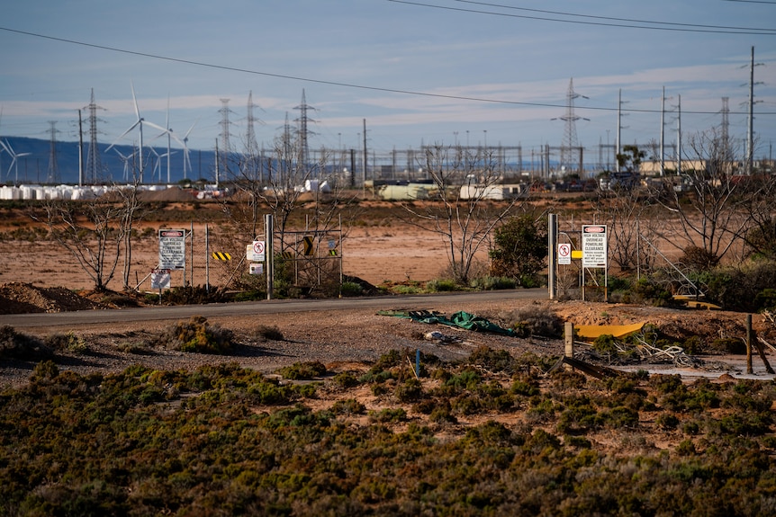 A view of powerlines and wind turbines in distance outside Port Augusta in SA.