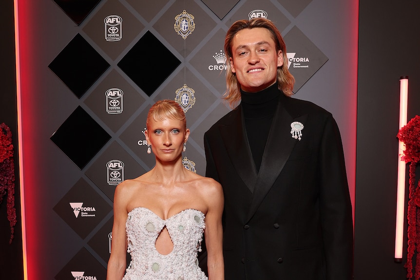Magpies captain Darcy Moore and partner Triple J presenter Dee Salmin.