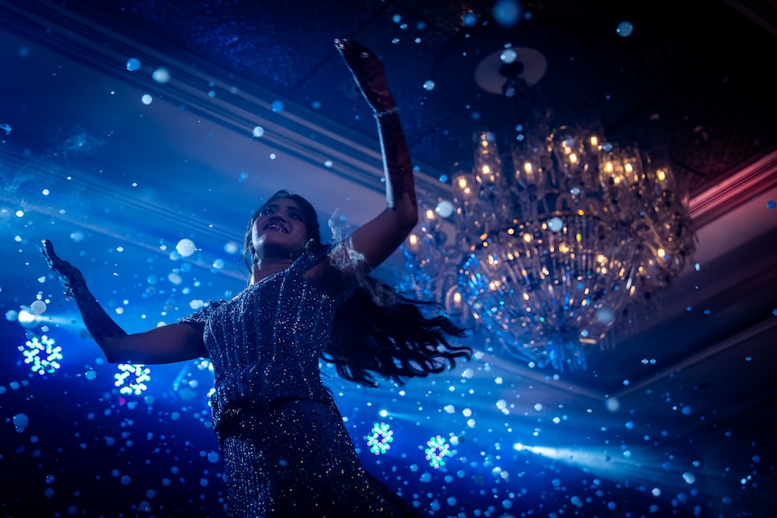 Khushi dances on stage during her wedding.