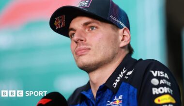 Red Bull's Max Verstappen speaking into an F1-branded microphone at the Miami Grand Prix