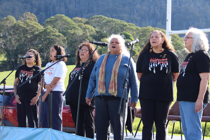 women singing on stage