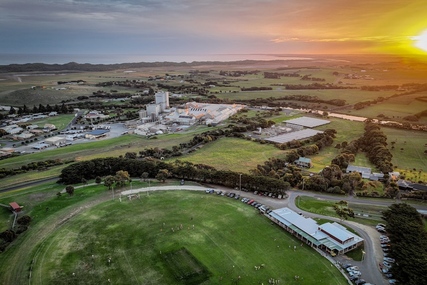 A drone photo of a football ground as the sun goes down