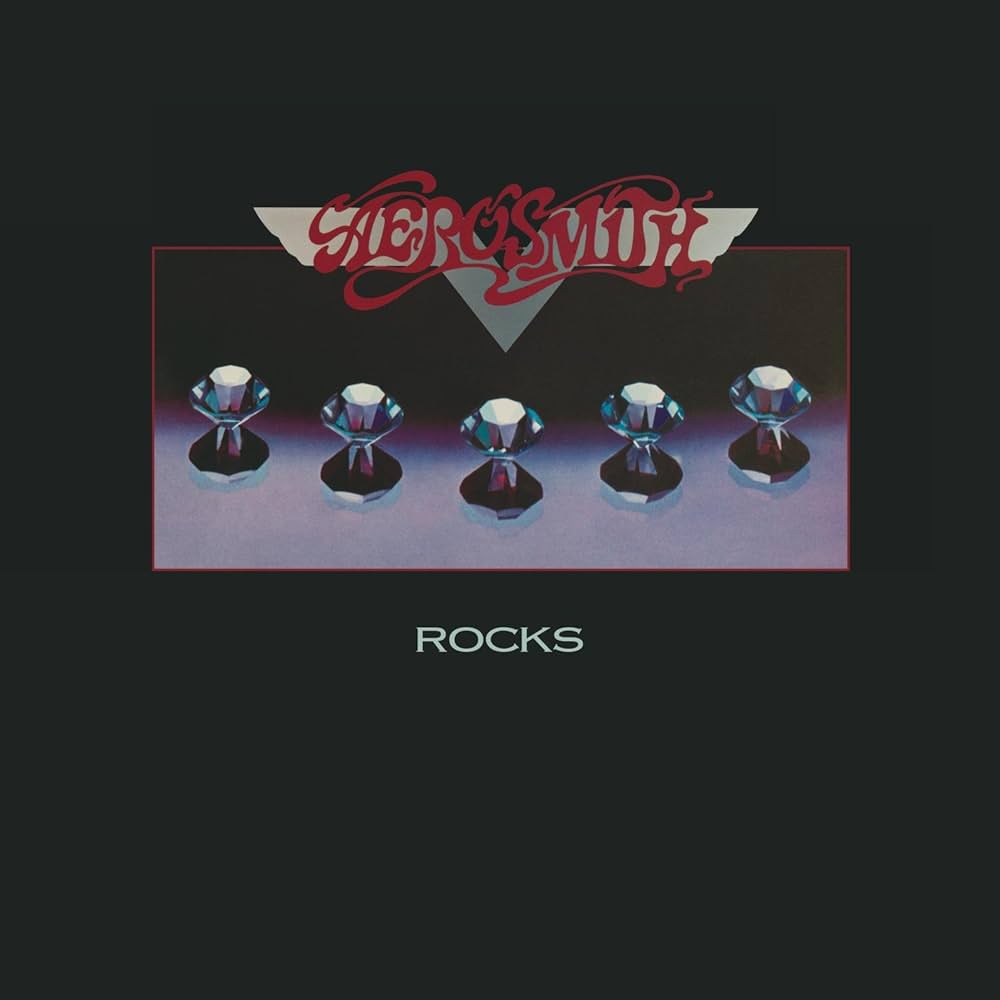Album cover featuring five diamonds and the words Aerosmith and Rocks