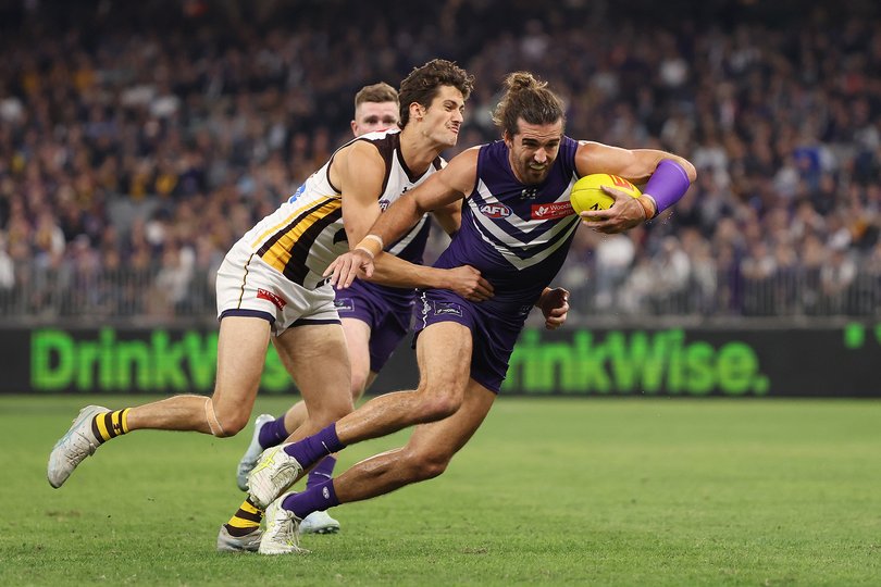 Alex Pearce of the Dockers is tackled by Max Ramsden.