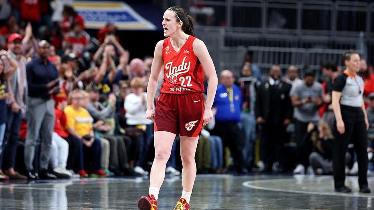 Caitlin Clark of the Indiana Fever celebrating after scoring a basket at Gainbridge Fieldhouse