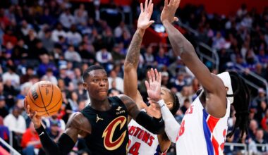 Cleveland Cavaliers guard Dennis Schroder, left, passes the ball against Detroit Pistons guard Daniss Jenkins (24) and forward Isaiah Stewart (28) during the first half in Game 2 of a second-round NBA playoffs basketball series, Thursday, May 7, 2026, in Detroit. (AP Photo/Duane Burleson)