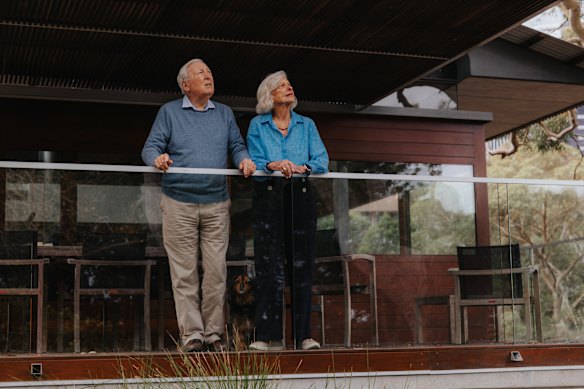 Terence and Tina Cole on the balcony of the house their son Richard Cole designed for them 10 years ago. The couple love living in the house, which has a lift, room for entertaining and is close to public transport.