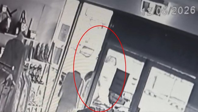 CCTV footage showing the alleged offender with bags of cash.
