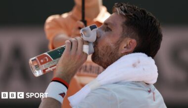 Cameron Norrie takes a drink of water