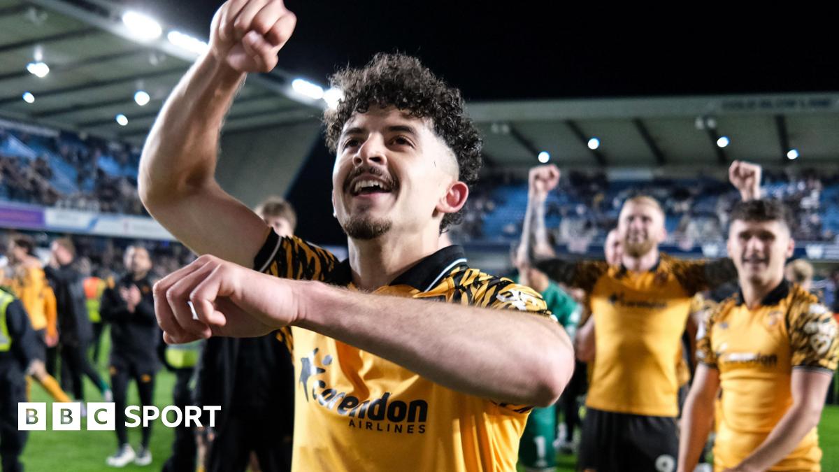 Hull City winger Mohamed Belloumi celebrates in front of his team-mates after their 2-0 win at Millwall