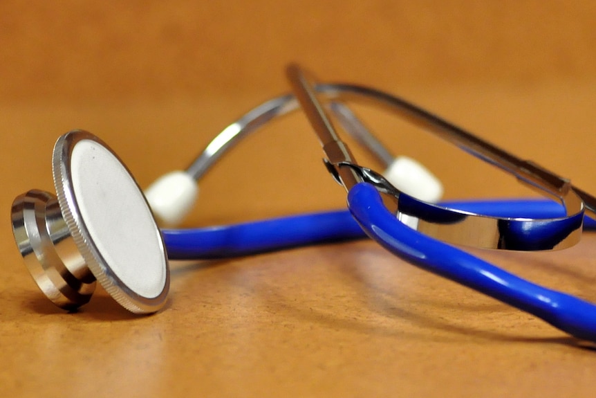 A stethoscope on a desk.