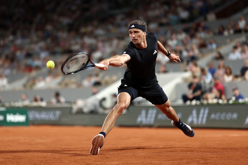Alexander Zverev reaches for a ball