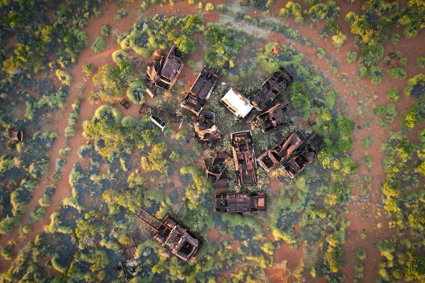An aerial photo of a rusted cars.
