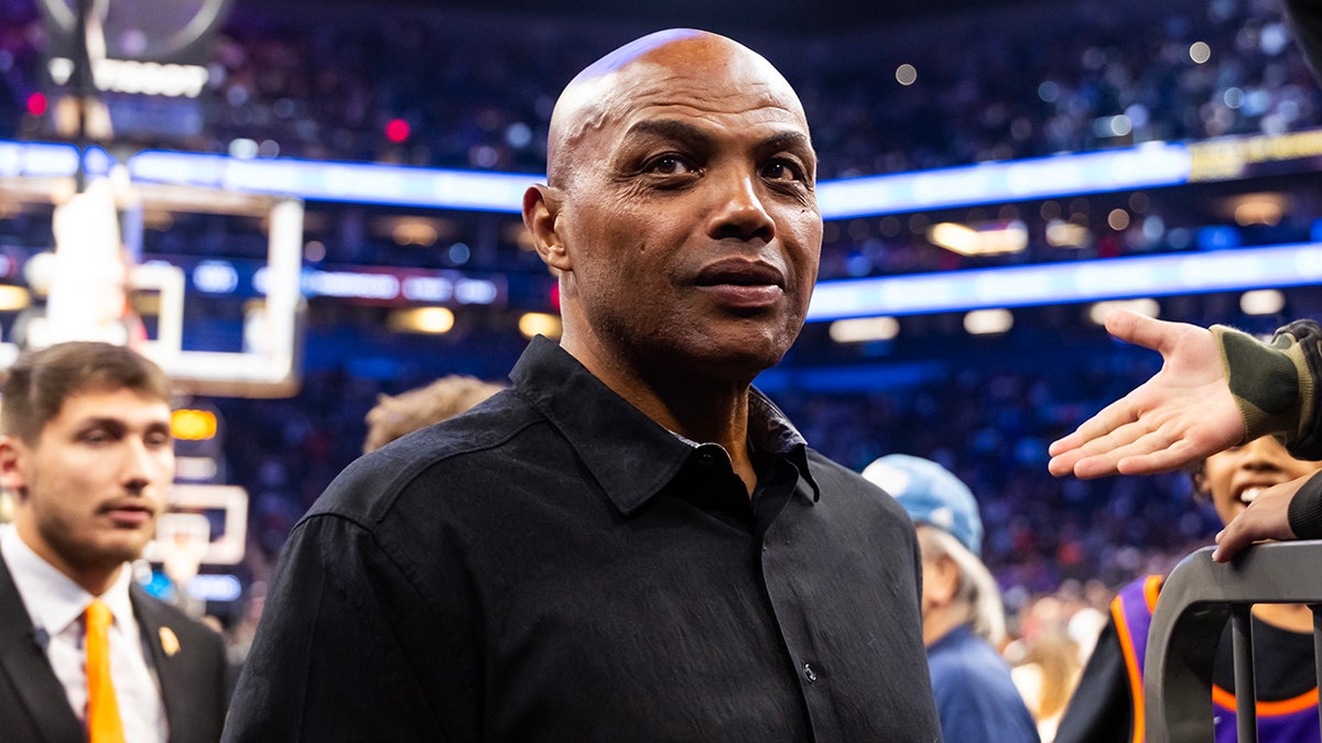 Charles Barkley standing on the basketball court during an NBA Cup game