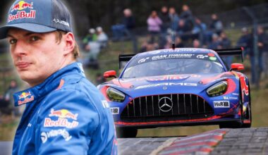 Verstappen in Red Bull kit looking over his Mercedes amg car driving on the Nurburgring
