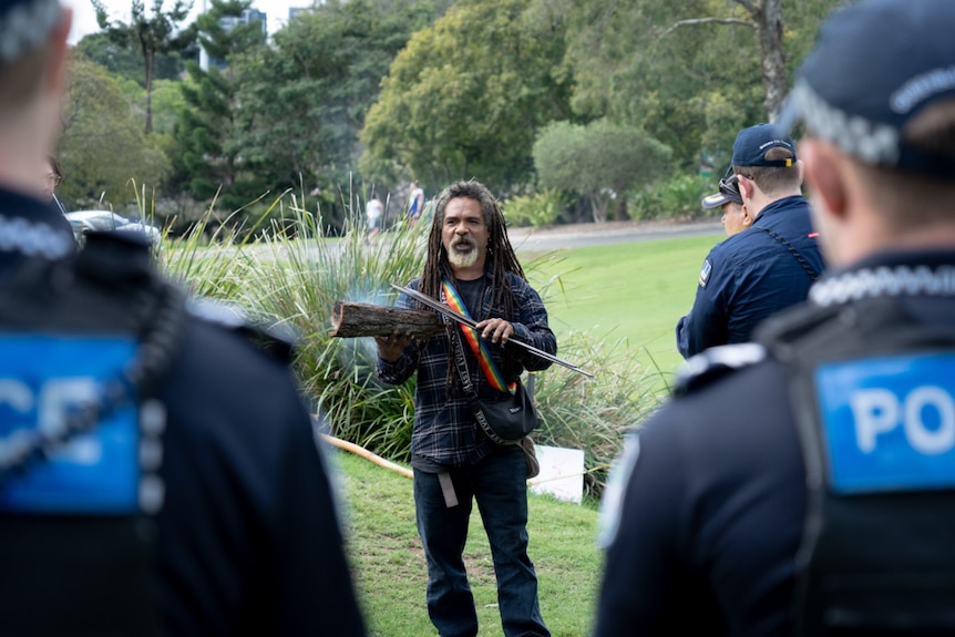 indigenous man with smoking ceremony