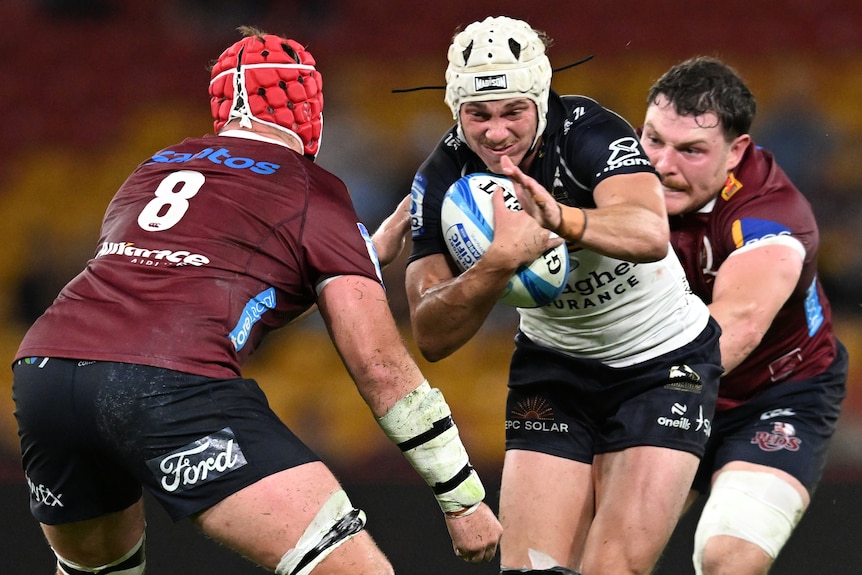 Declan Meredith runs the ball for the Brumbies against the Reds.