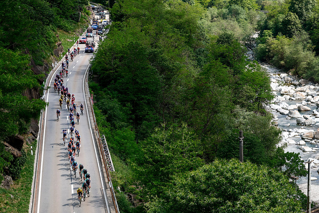 The pack rides during the 16th stage of the Giro d'Italia 2026 - Tour of Italy cycling race between Bellinzona and Cari, Switzerland, on May 26, 2026. (Photo by Luca Bettini / AFP)