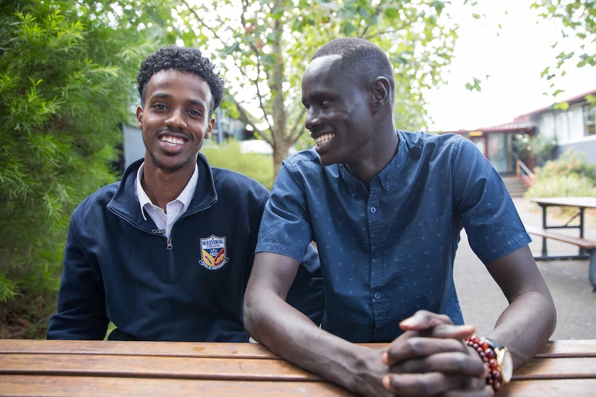 Maribyrnong College school captain Mohamed Semra (left) with teacher's aide Alor Deng.