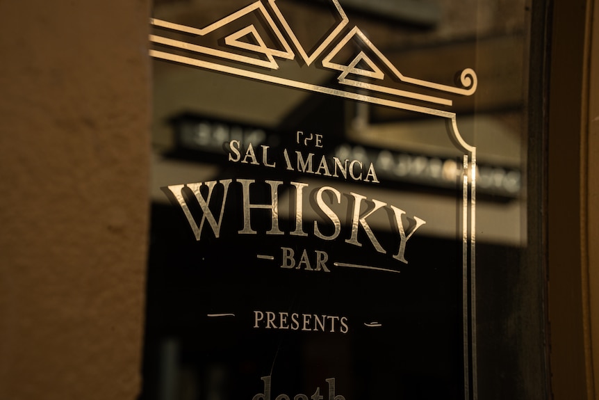 A sign outside a bar saying Salamanca Whisky Bar